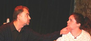 Kevin L. Knights, as Walter, lectures Jamie DesRocher, who plays the captive Keely